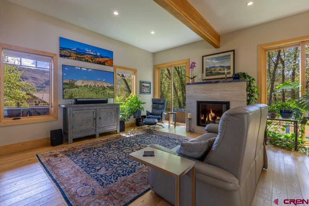 7041 County Road 203 Durango, CO 81301 - Photo 11 of 45 a living room with furniture and a fireplace