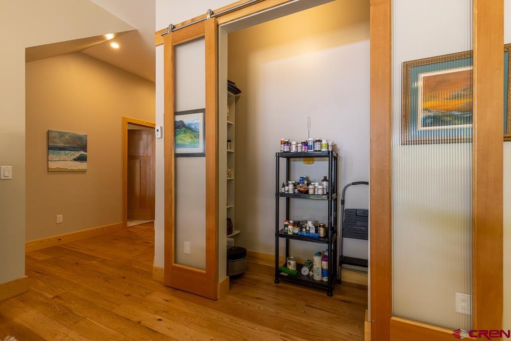 7041 County Road 203 Durango, CO 81301 - Photo 12 of 45 a view of a hallway with wooden floor and closet