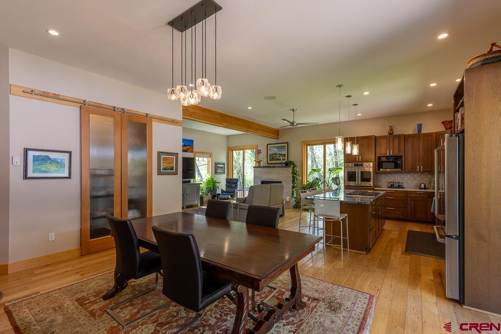 7041 County Road 203 Durango, CO 81301 - Photo 15 of 45 a view of a dining room with furniture window and wooden floor