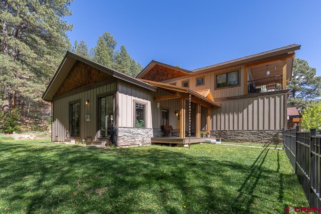 7041 County Road 203 Durango, CO 81301 - Photo 2 of 45 a front view of a house with a yard