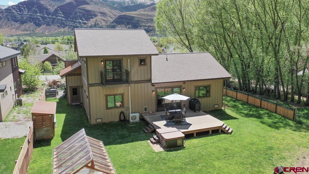 7041 County Road 203 Durango, CO 81301 - Photo 40 of 45 a aerial view of a house with table and chairs in patio