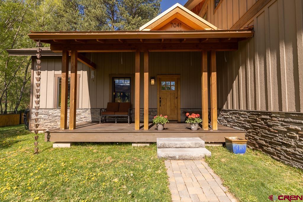 7041 County Road 203 Durango, CO 81301 - Photo 4 of 45 a view of a house with a porch and furniture