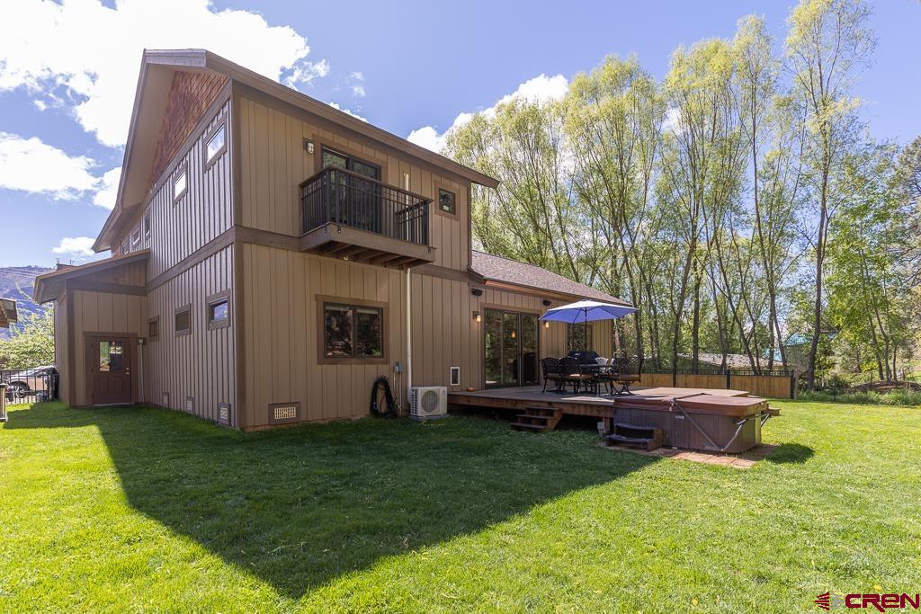7041 County Road 203 Durango, CO 81301 - Photo 41 of 45 a view of a house with a back yard