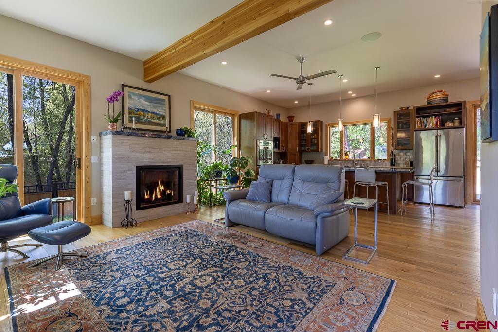 7041 County Road 203 Durango, CO 81301 - Photo 7 of 45 a living room with furniture and a fireplace