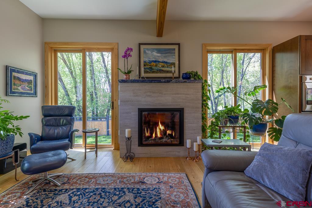 7041 County Road 203 Durango, CO 81301 - Photo 9 of 45 a living room with furniture and a fireplace