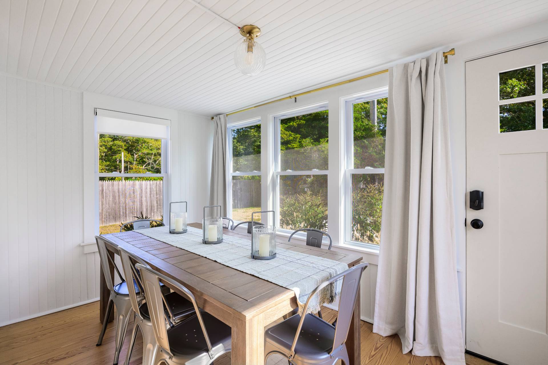 86 Old Country Road East Quogue, NY 11942 - Photo 11 of 16 a view of a dining room with furniture window and outside view