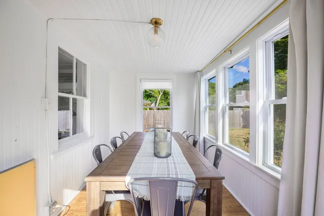a dining room with furniture and window