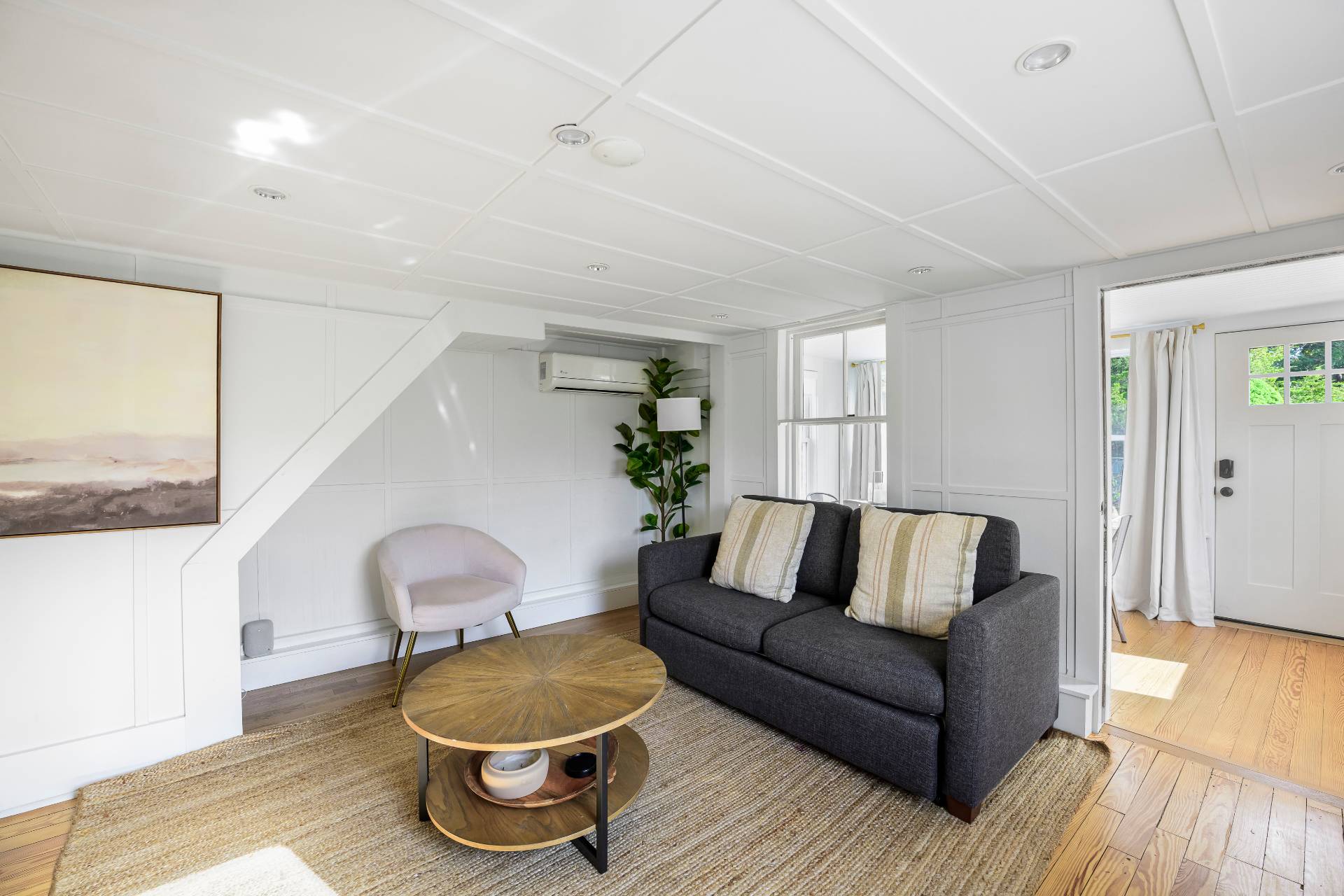 86 Old Country Road East Quogue, NY 11942 - Photo 6 of 16 a living room with furniture and a wooden floor