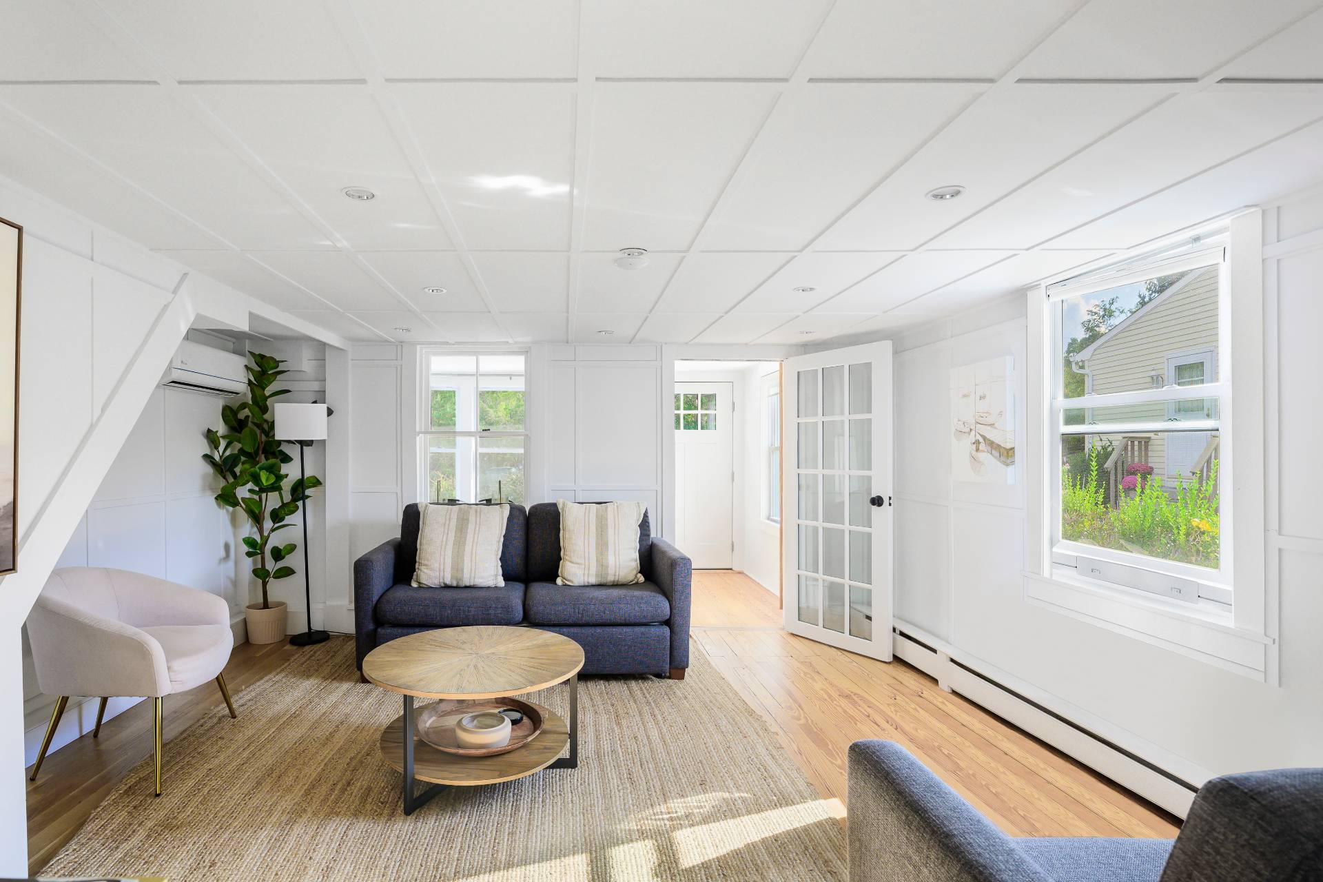 86 Old Country Road East Quogue, NY 11942 - Photo 7 of 16 a living room with furniture and a window