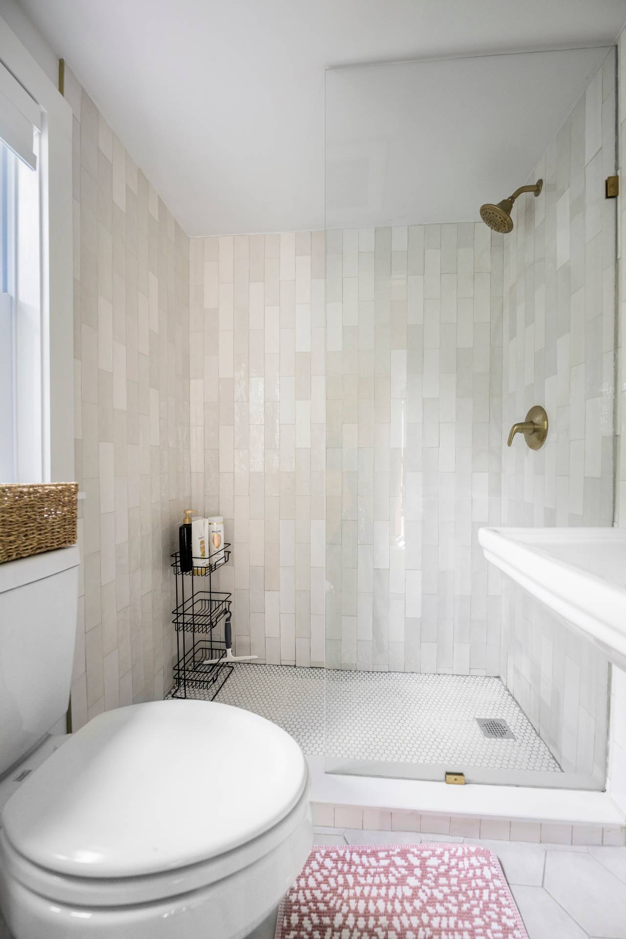 86 Old Country Road East Quogue, NY 11942 - Photo 10 of 16 a bathroom with a toilet a sink and bathtub