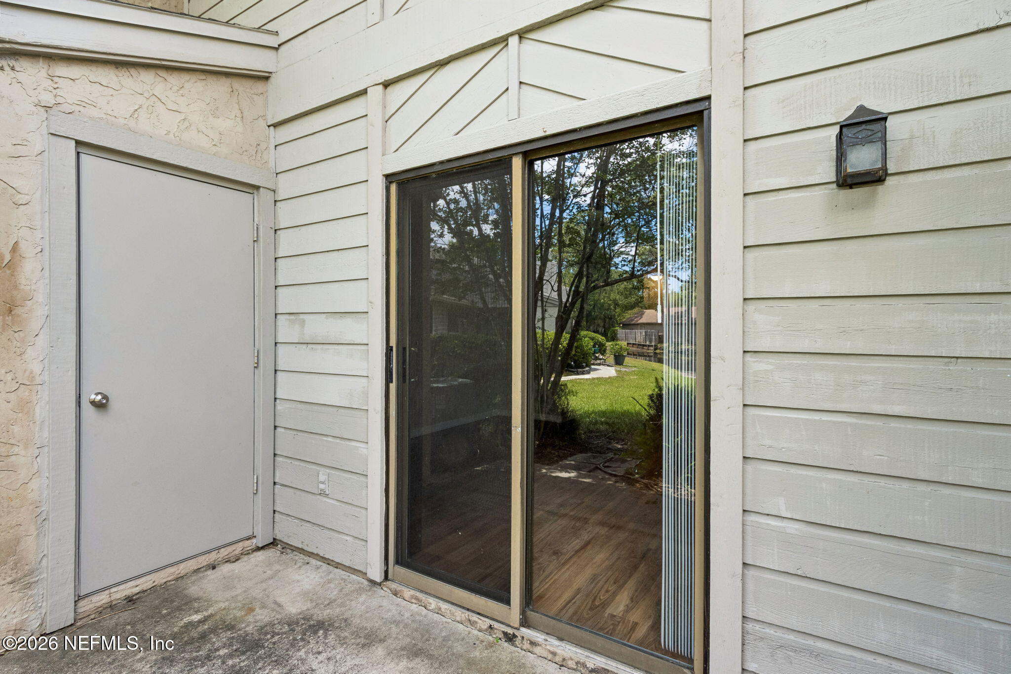 3801 Crown Point Road, Unit 1184 Jacksonville, FL 32257 - Photo 26 of 35 Back Porch with Storage Closet
