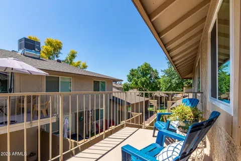 a view of a house with a door and wooden floor