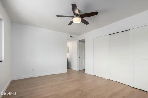 a bathroom with a sink vanity granite and toilet