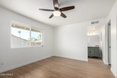 a bathroom with a shower curtain and a sink