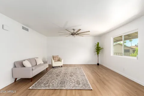 a living room with furniture and a window