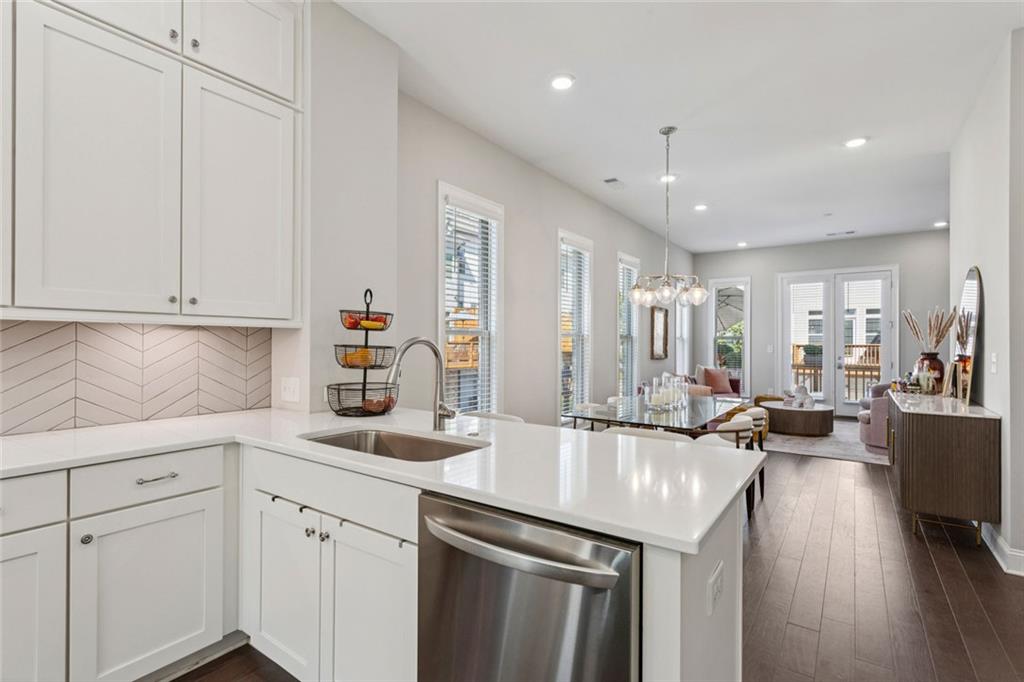 4219 Deming Circle Sandy Springs, GA 30342 - Photo 13 of 40 a kitchen with sink refrigerator and cabinets