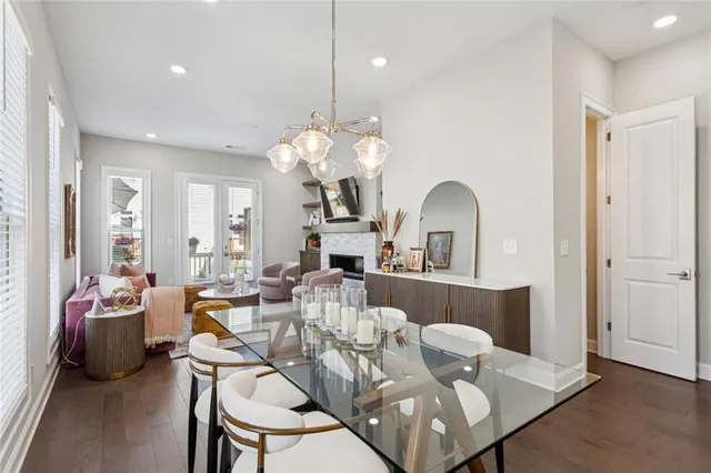 a view of a dining room with furniture and chandelier