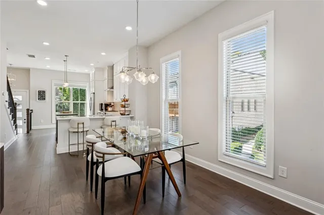 a view of a dining room with furniture and wooden floor