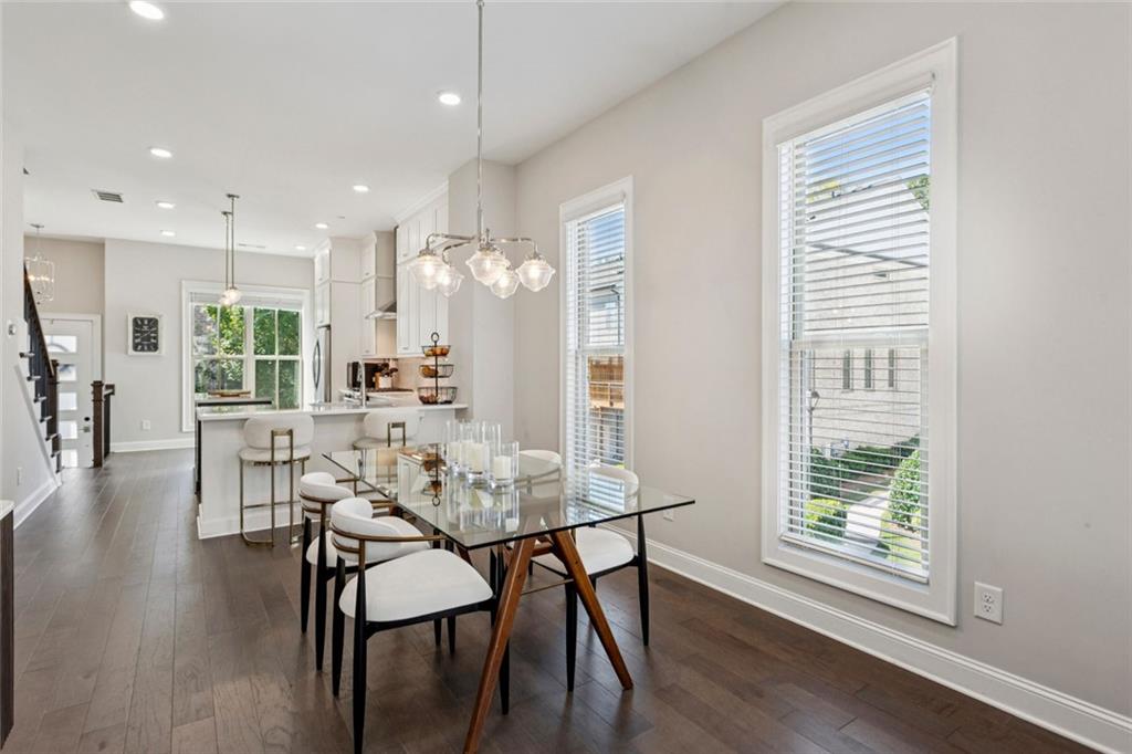 4219 Deming Circle Sandy Springs, GA 30342 - Photo 17 of 40 a view of a dining room with furniture and wooden floor