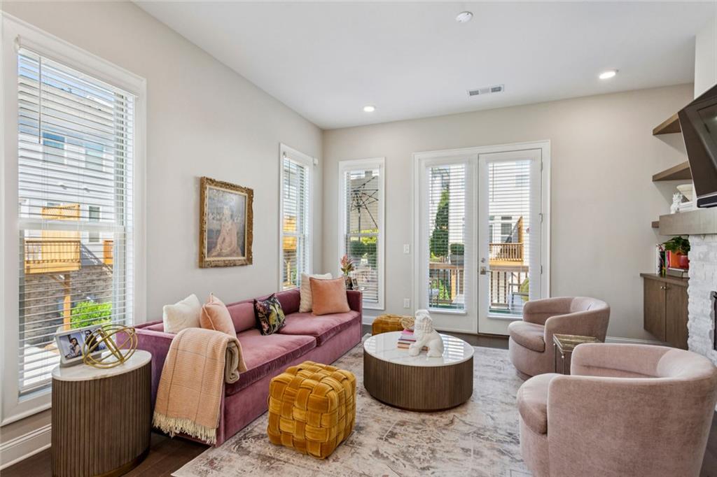 4219 Deming Circle Sandy Springs, GA 30342 - Photo 21 of 40 a living room with furniture and a potted plant