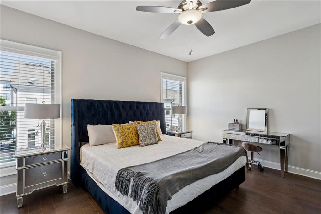 4219 Deming Circle Sandy Springs, GA 30342 - Photo 25 of 40 a bedroom with a bed and a chandelier