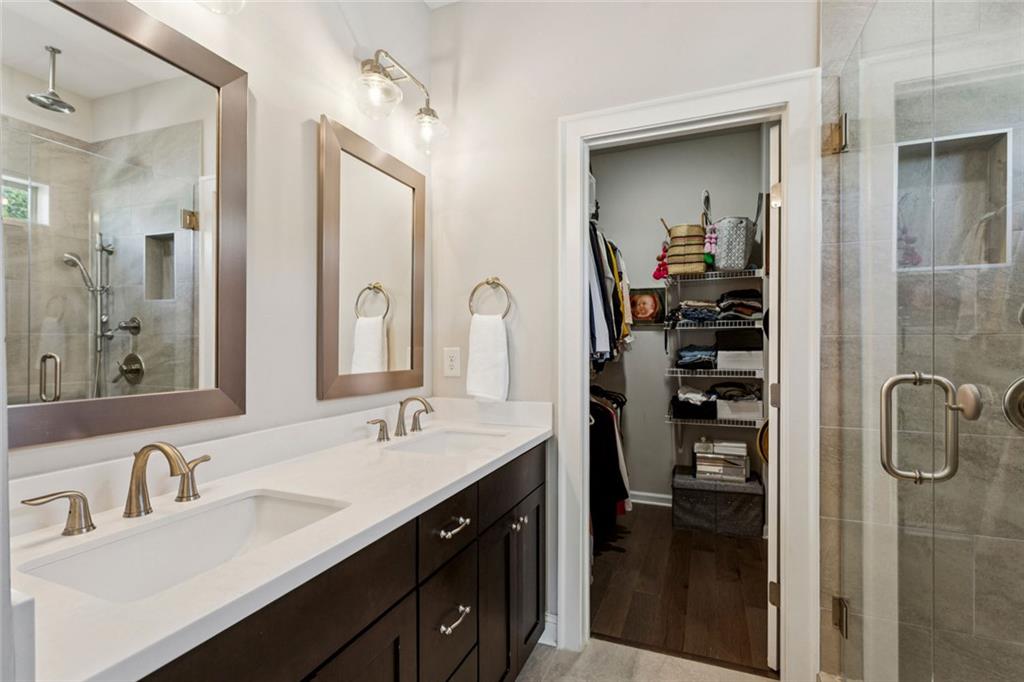 4219 Deming Circle Sandy Springs, GA 30342 - Photo 28 of 40 a en suite bathroom with a double vanity sink a and mirror