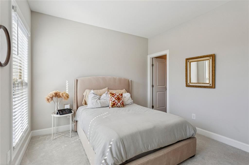4219 Deming Circle Sandy Springs, GA 30342 - Photo 32 of 40 a bedroom with a bed and a window