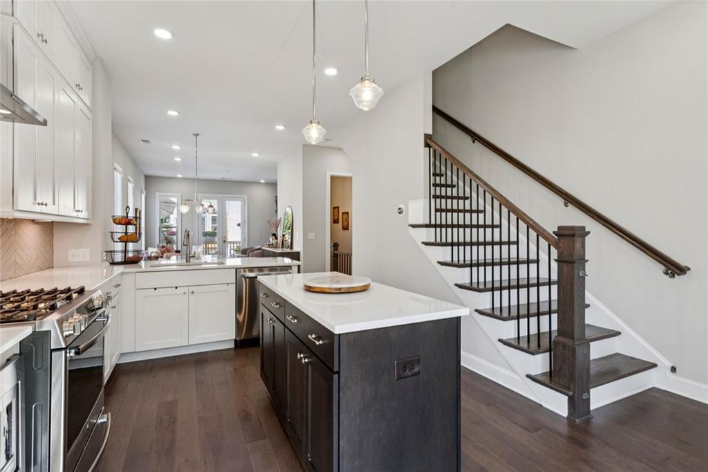 4219 Deming Circle Sandy Springs, GA 30342 - Photo 8 of 40 a kitchen with white cabinets appliances and a center island