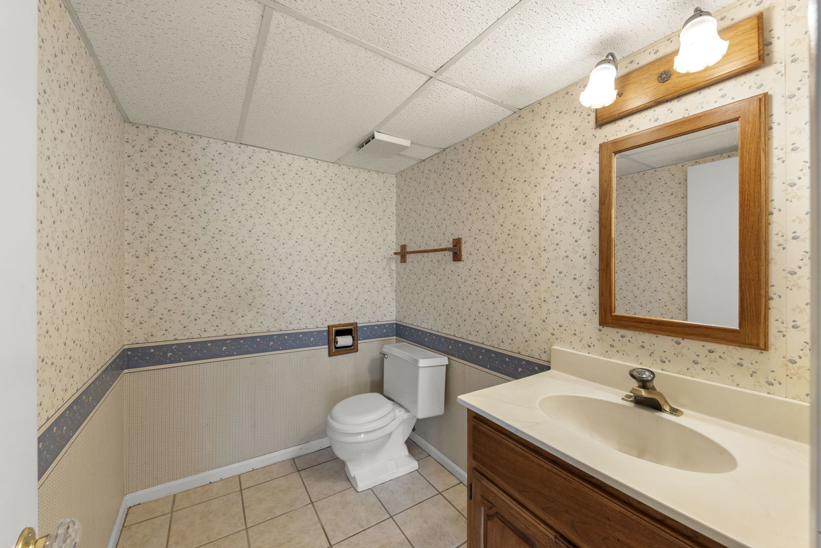 1308 Stonegate Road Naperville, IL 60540 - Photo 12 of 30 a bathroom with a sink mirror vanity and toilet