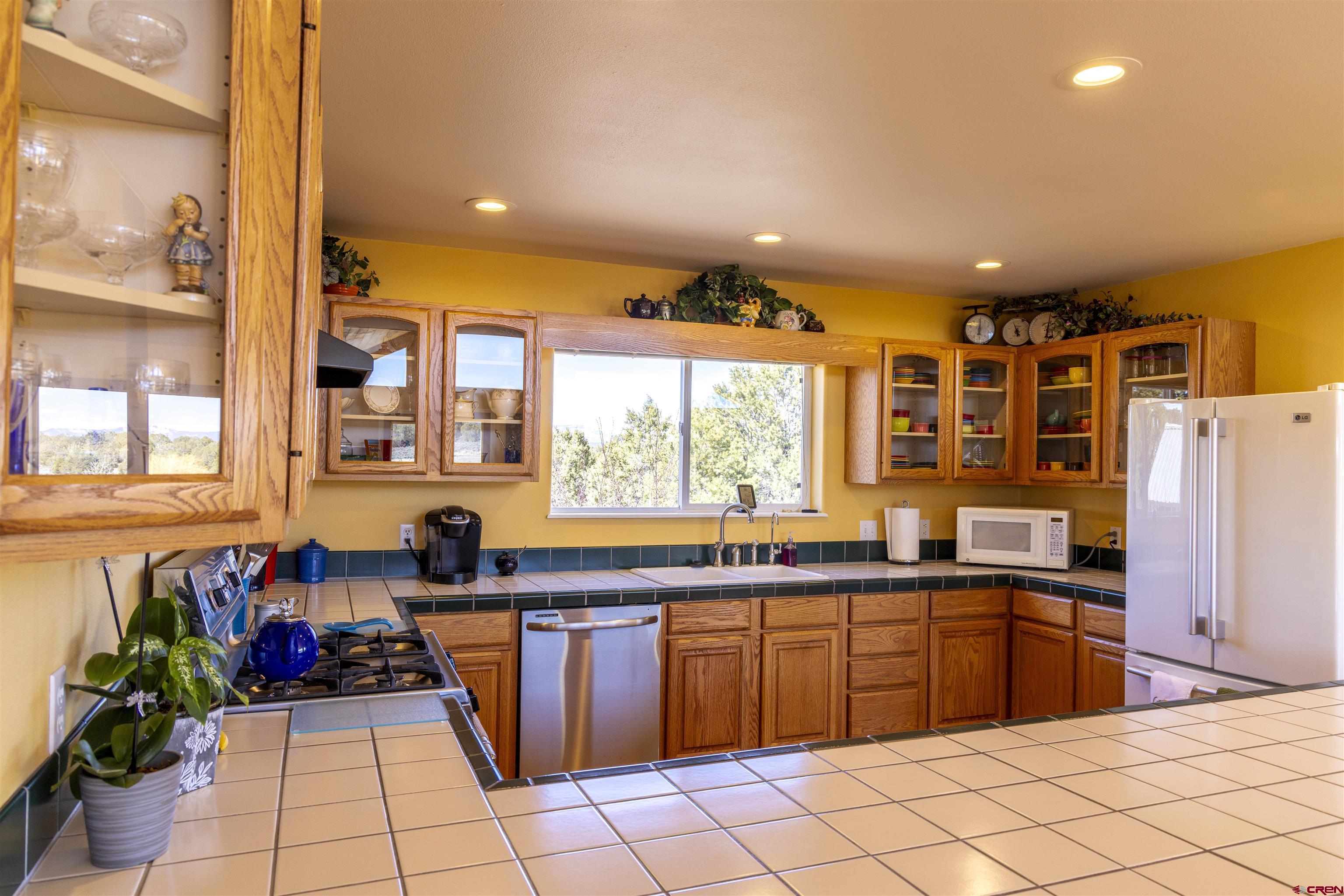 63 Sagewood Drive Ignacio, CO 81137 - Photo 11 of 33 a kitchen with a sink and cabinets