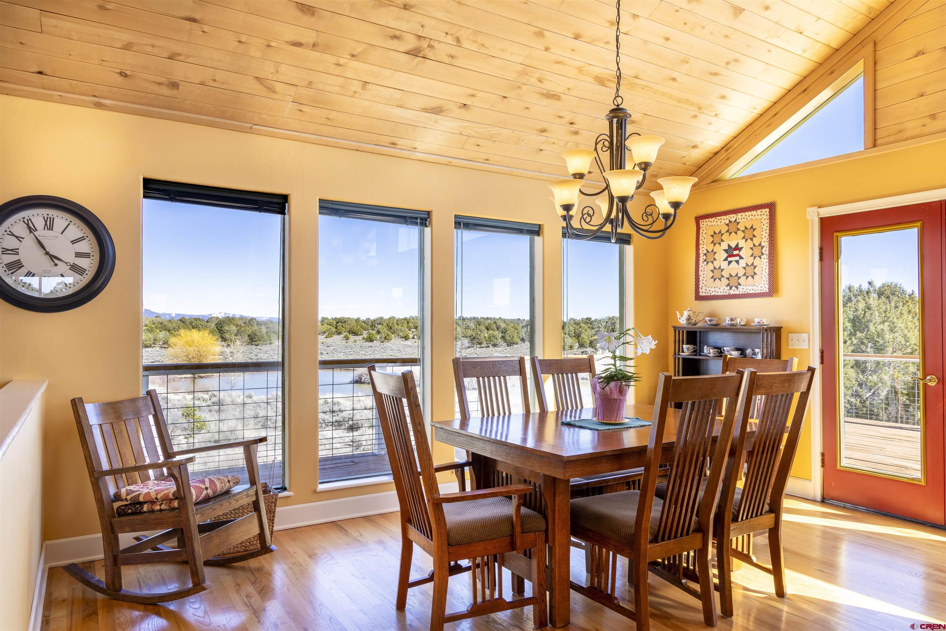 63 Sagewood Drive Ignacio, CO 81137 - Photo 14 of 33 a view of a dining room with furniture window and wooden floor