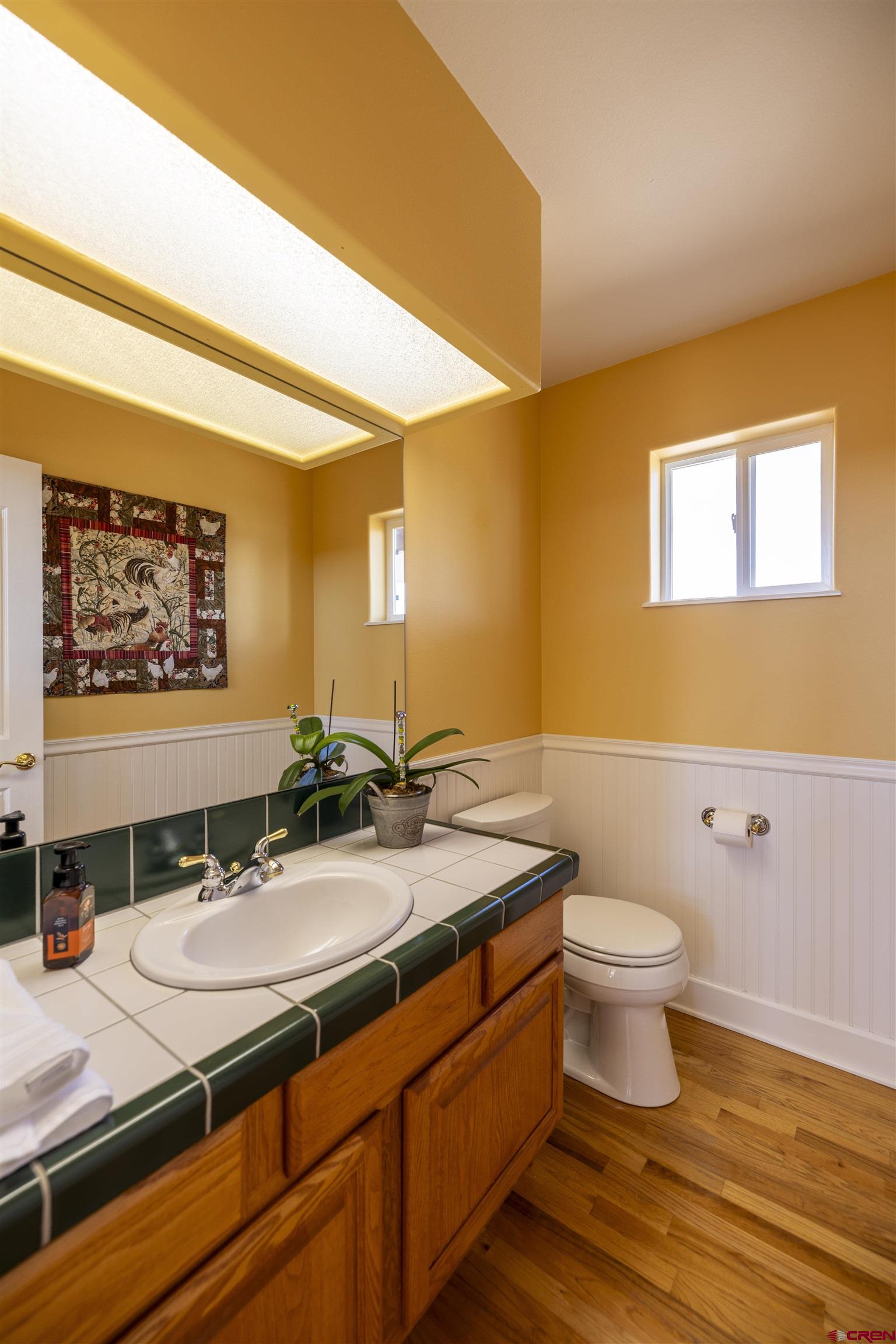 63 Sagewood Drive Ignacio, CO 81137 - Photo 15 of 33 a bathroom with a granite countertop sink and a mirror