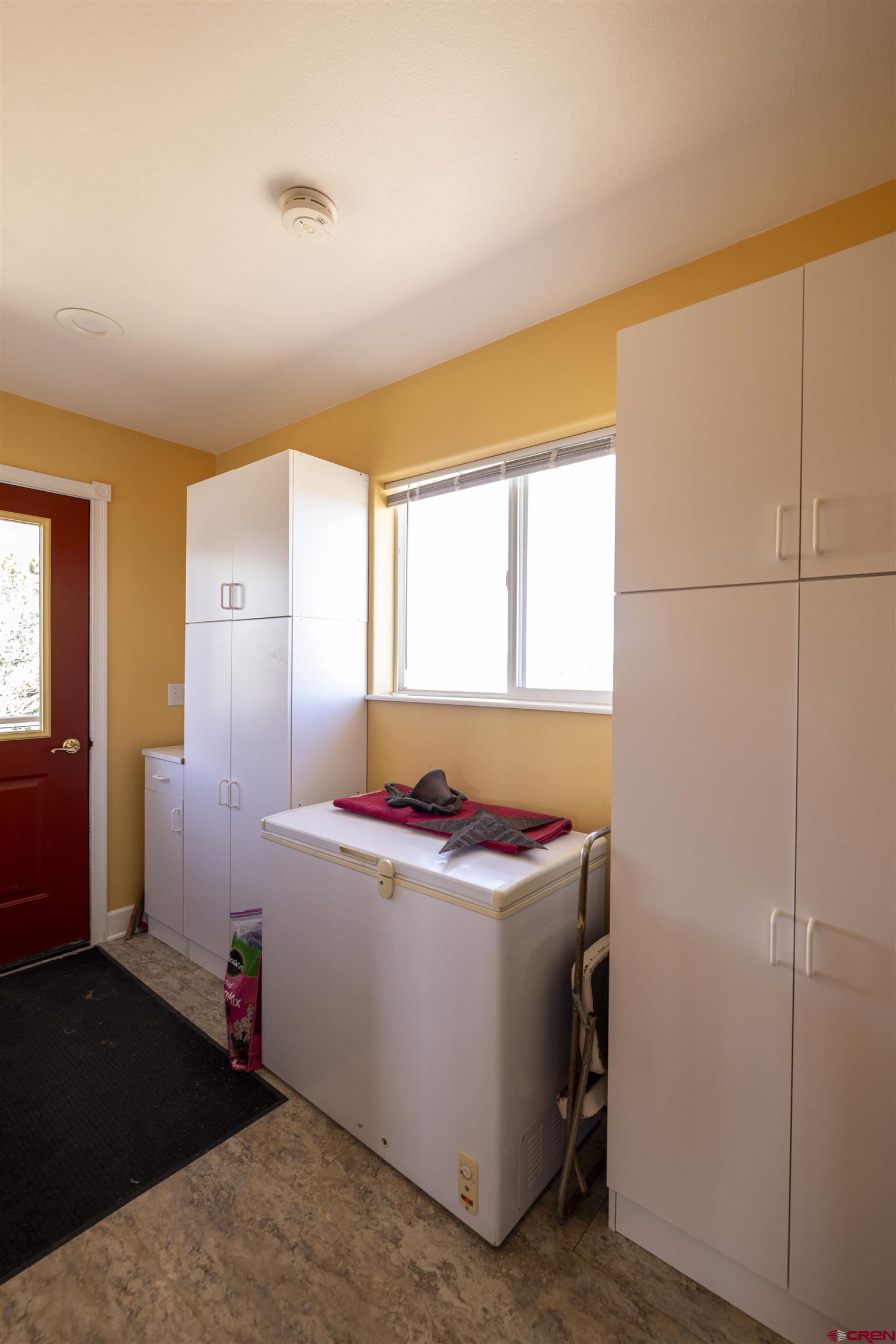 63 Sagewood Drive Ignacio, CO 81137 - Photo 16 of 33 a storage room with washer and dryer