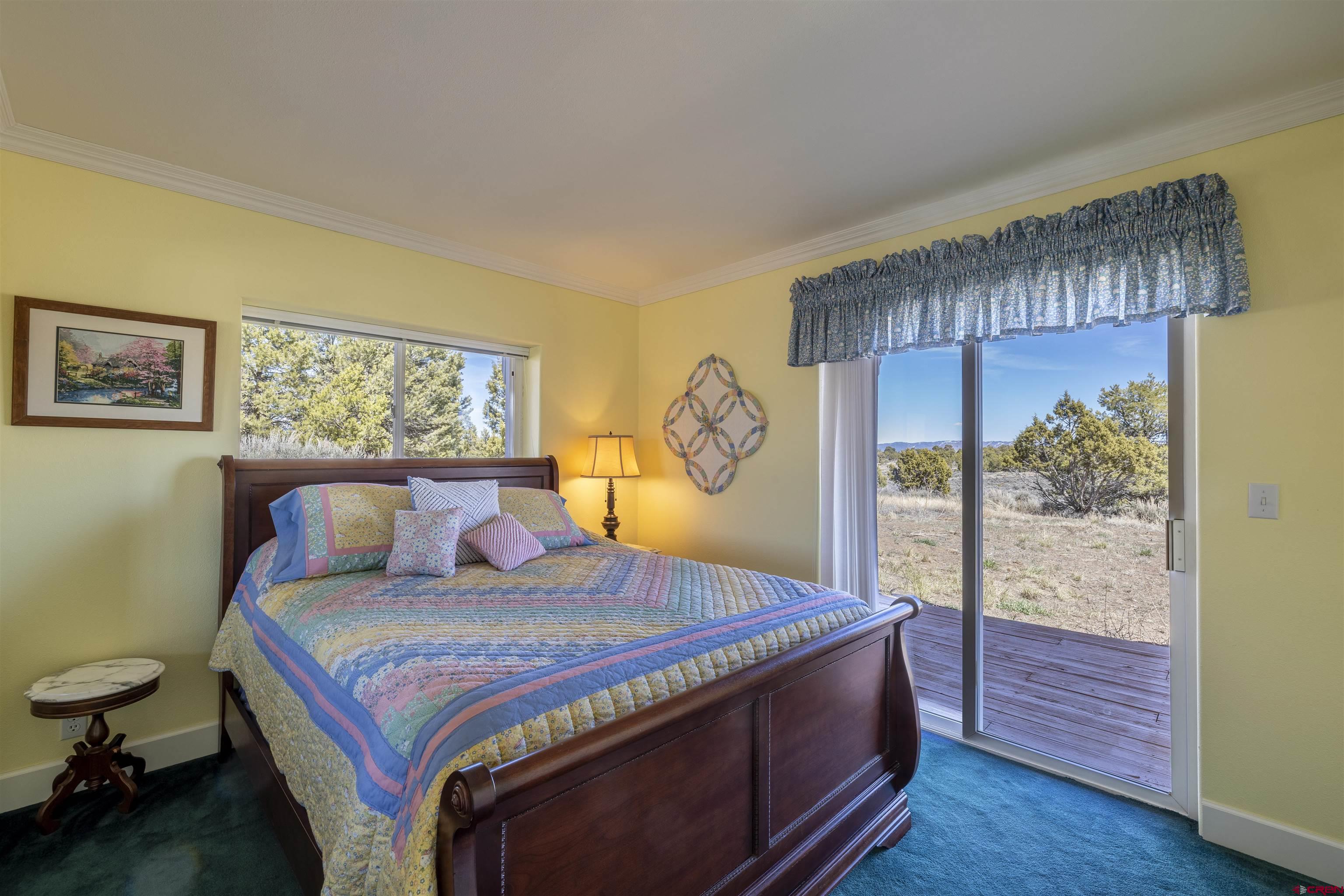 63 Sagewood Drive Ignacio, CO 81137 - Photo 23 of 33 a bedroom with a bed and a window