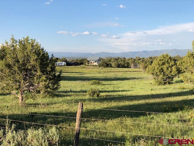 63 Sagewood Drive Ignacio, CO 81137 - Photo 31 of 33 a view of a lake with a big yard