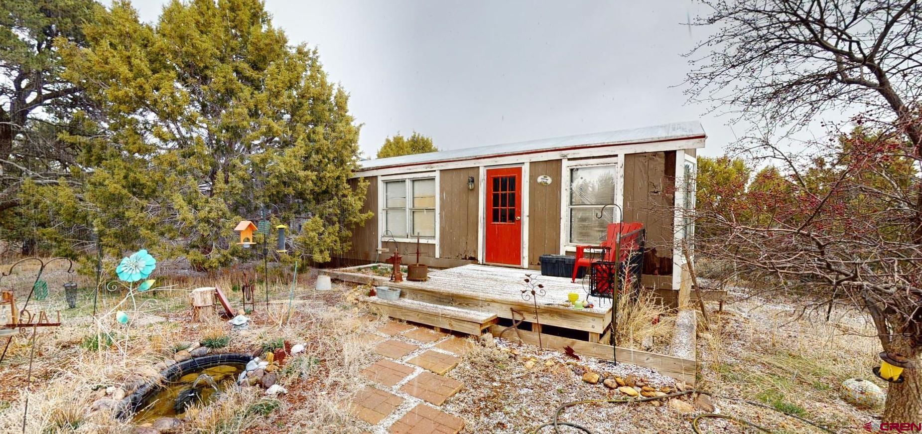 63 Sagewood Drive Ignacio, CO 81137 - Photo 32 of 33 a backyard of a house with table and chairs