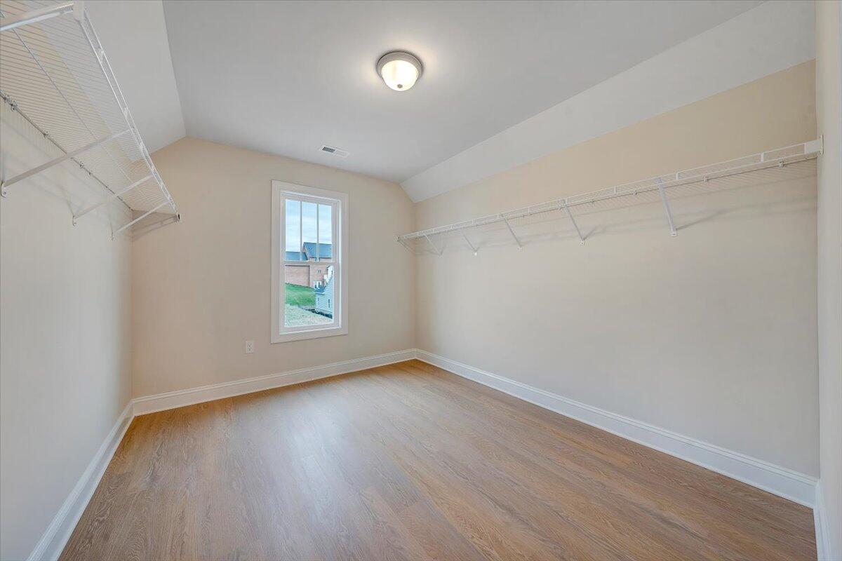5275 Arrowhead Trail Salem, VA 24153 - Photo 15 of 18 a view of an empty room with wooden floor and a window
