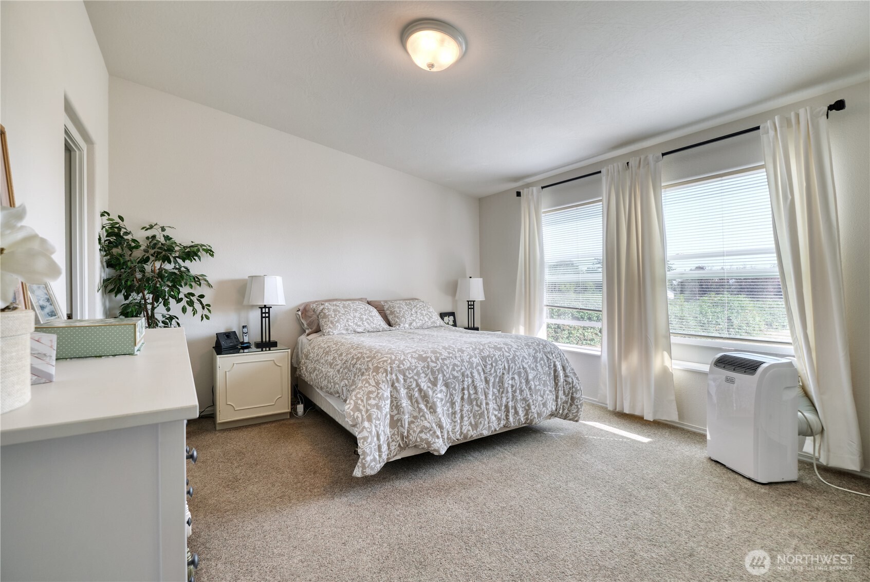 1940 APA Road Point Roberts, WA 98281 - Photo 16 of 35 a spacious bedroom with a bed and a couch