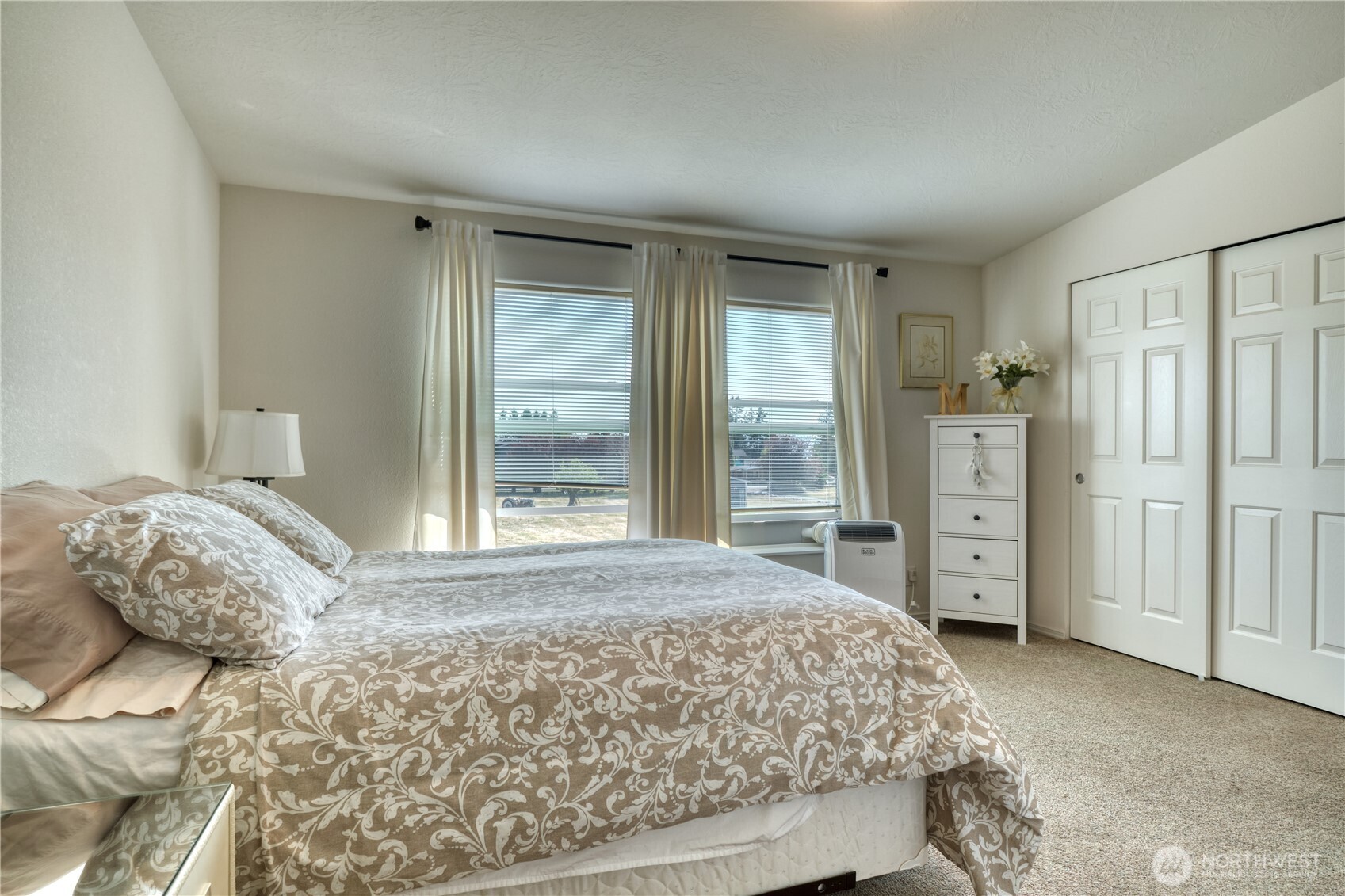 1940 APA Road Point Roberts, WA 98281 - Photo 20 of 35 a bedroom with a large bed and a window