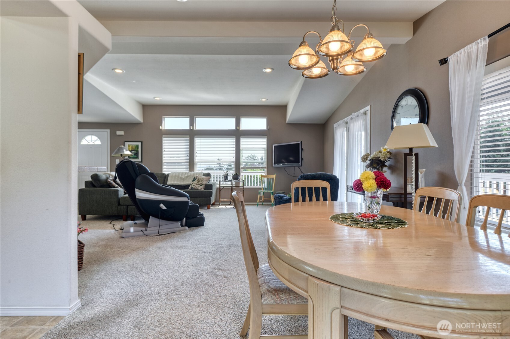 1940 APA Road Point Roberts, WA 98281 - Photo 3 of 35 a view of a dining room with furniture a chandelier and large windows