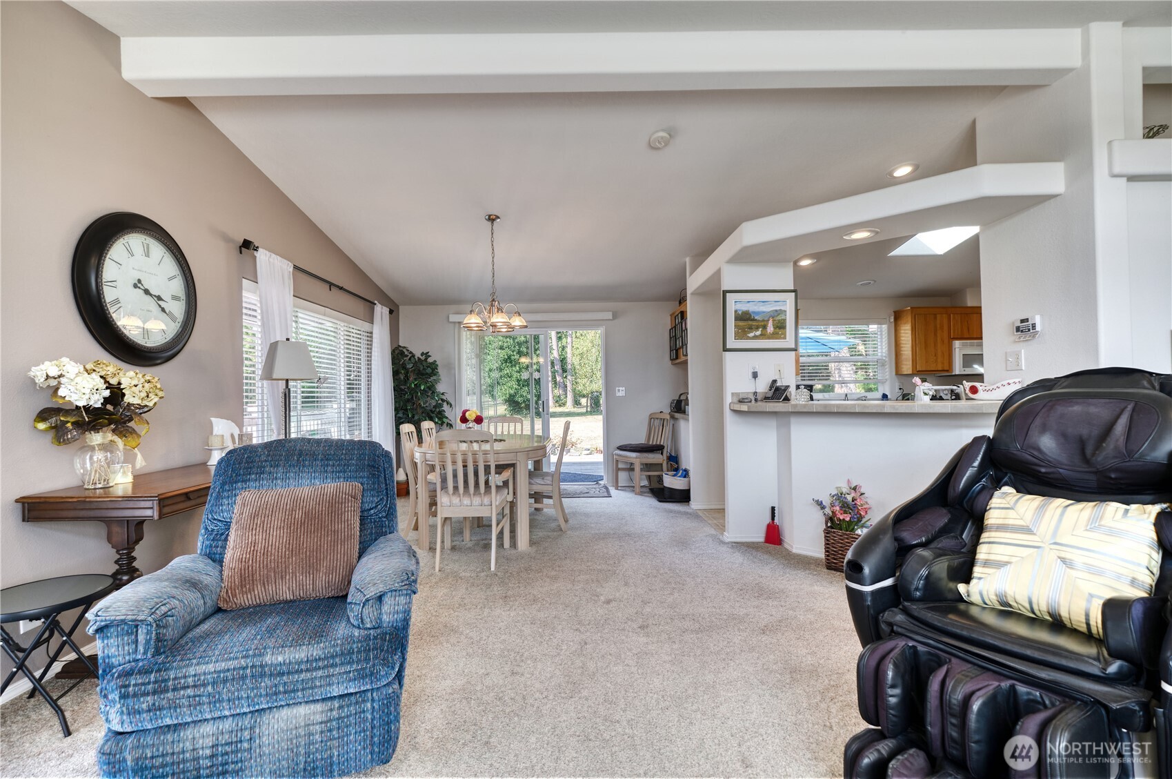 1940 APA Road Point Roberts, WA 98281 - Photo 6 of 35 a living room with furniture a chandelier couches and a large window