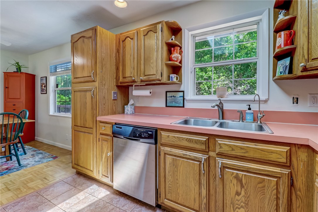 1401 Leon Street Fernandina Beach, FL 32034 - Photo 13 of 32 a kitchen with stainless steel appliances granite countertop a refrigerator and a sink