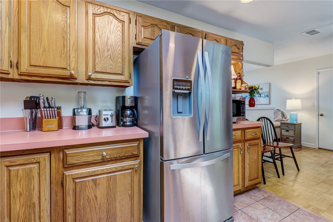 1401 Leon Street Fernandina Beach, FL 32034 - Photo 14 of 32 a kitchen with stainless steel appliances granite countertop a refrigerator and a stove top oven