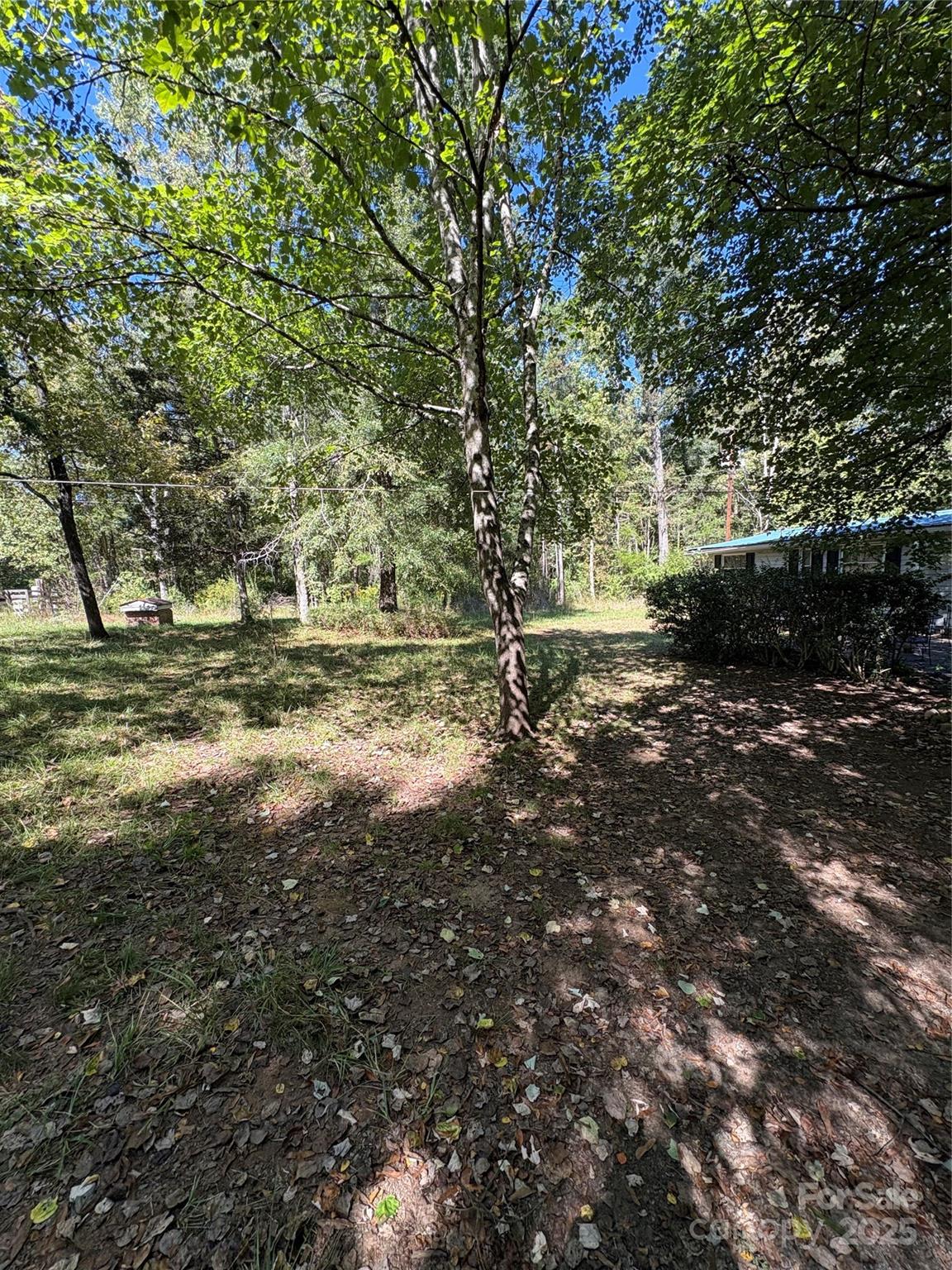 8101 Waxhaw Creek Road Waxhaw, NC 28173 - Photo 2 of 10 a backyard of a house with a yard and outdoor seating