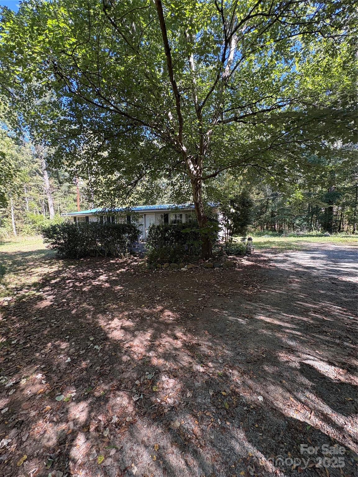 8101 Waxhaw Creek Road Waxhaw, NC 28173 - Photo 3 of 10 a view of outdoor space with deck and trees