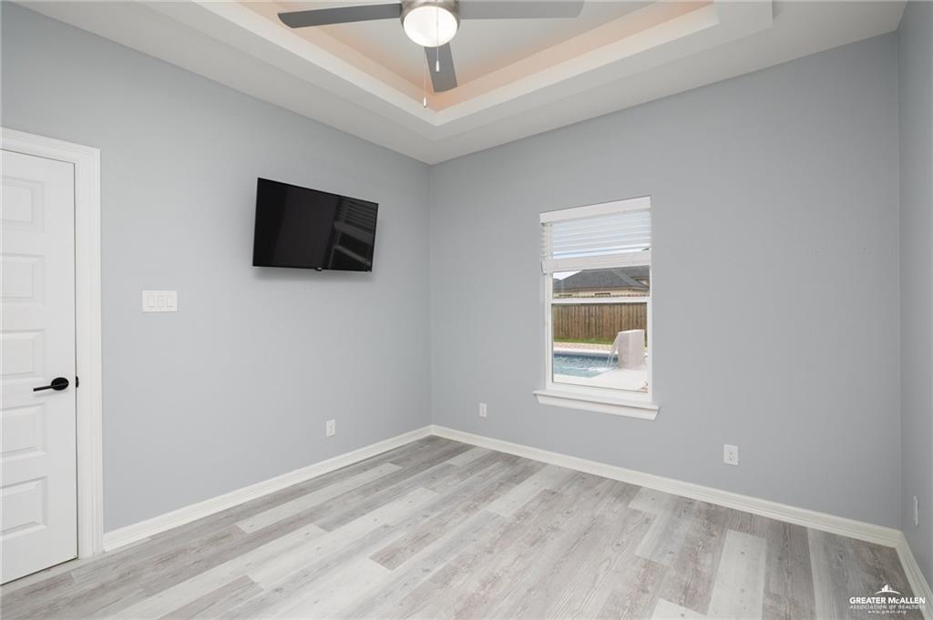 5904 North Dodger Street Pharr, TX 78577 - Photo 13 of 24 a view of a livingroom with a flat screen tv