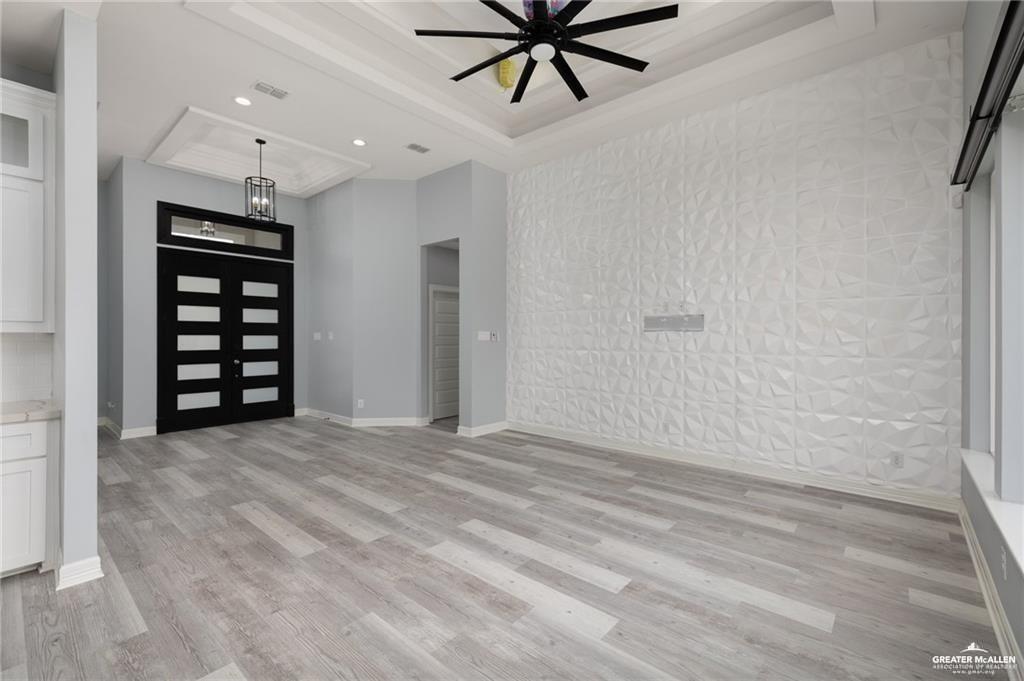 5904 North Dodger Street Pharr, TX 78577 - Photo 4 of 24 a view of a livingroom with a ceiling fan and window