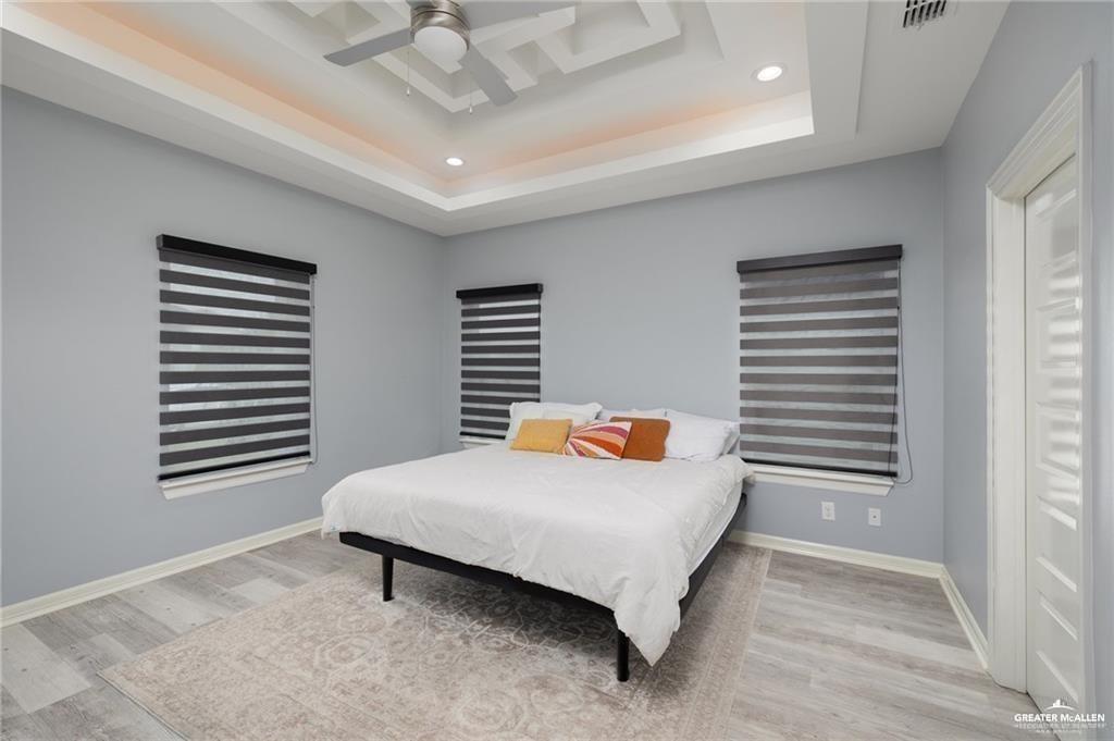 5904 North Dodger Street Pharr, TX 78577 - Photo 7 of 24 a bedroom with a bed and a window