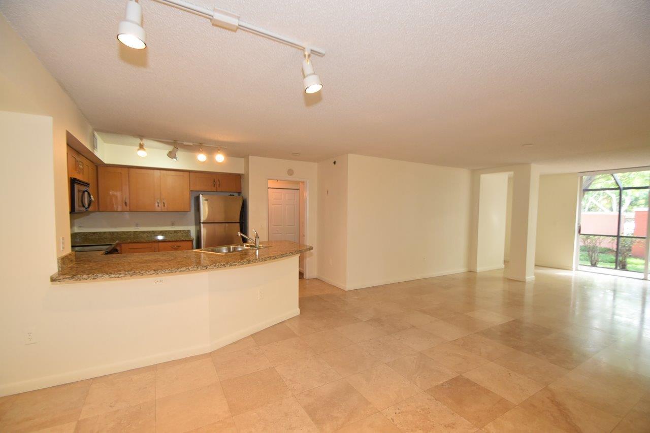 3237 Clint Moore Road, Unit 104 Boca Raton, FL 33496 - Photo 3 of 21 Kitchen and Living