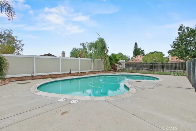 a view of swimming pool with a yard